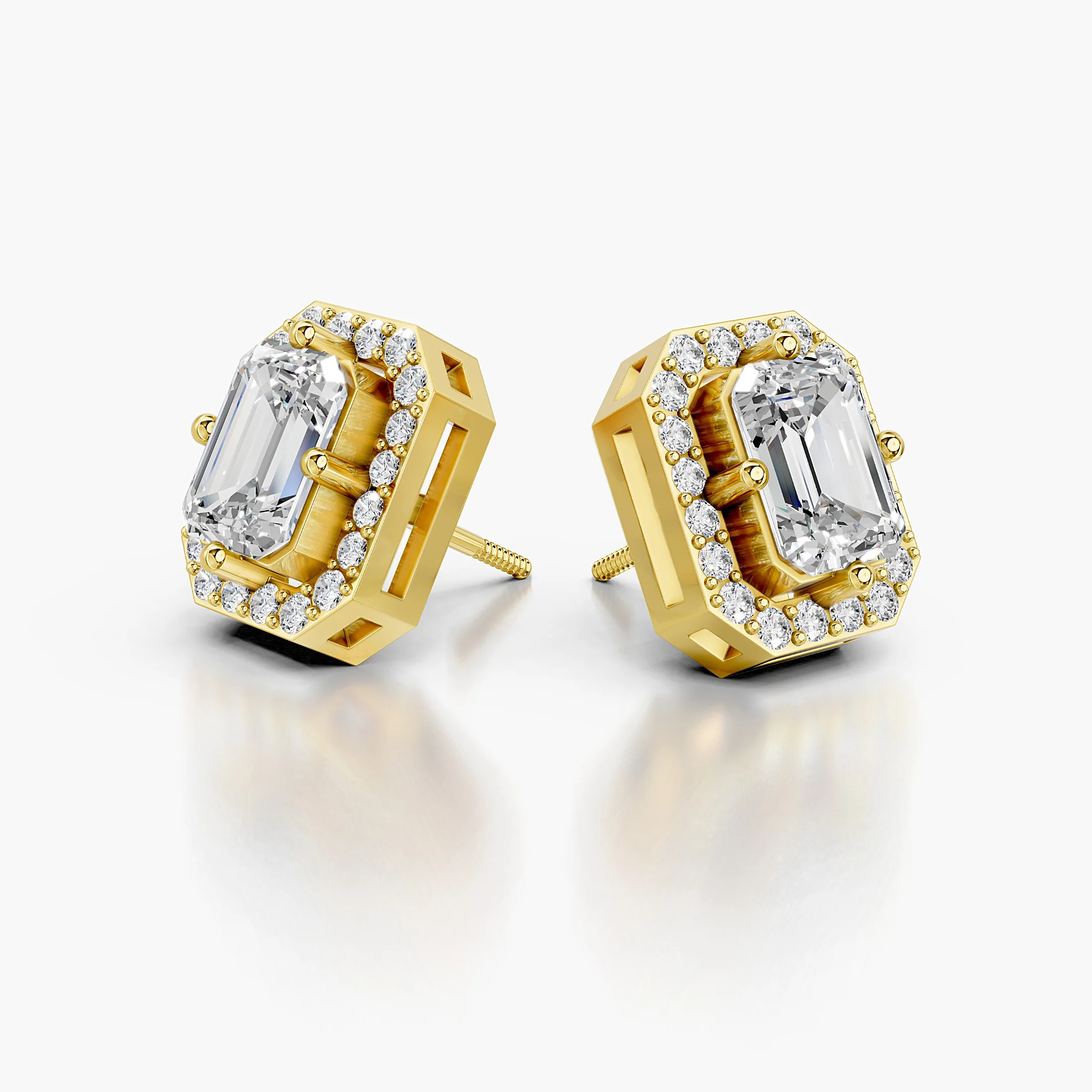Emerald diamond stud earrings with geometric round diamond halos and screw-back closures