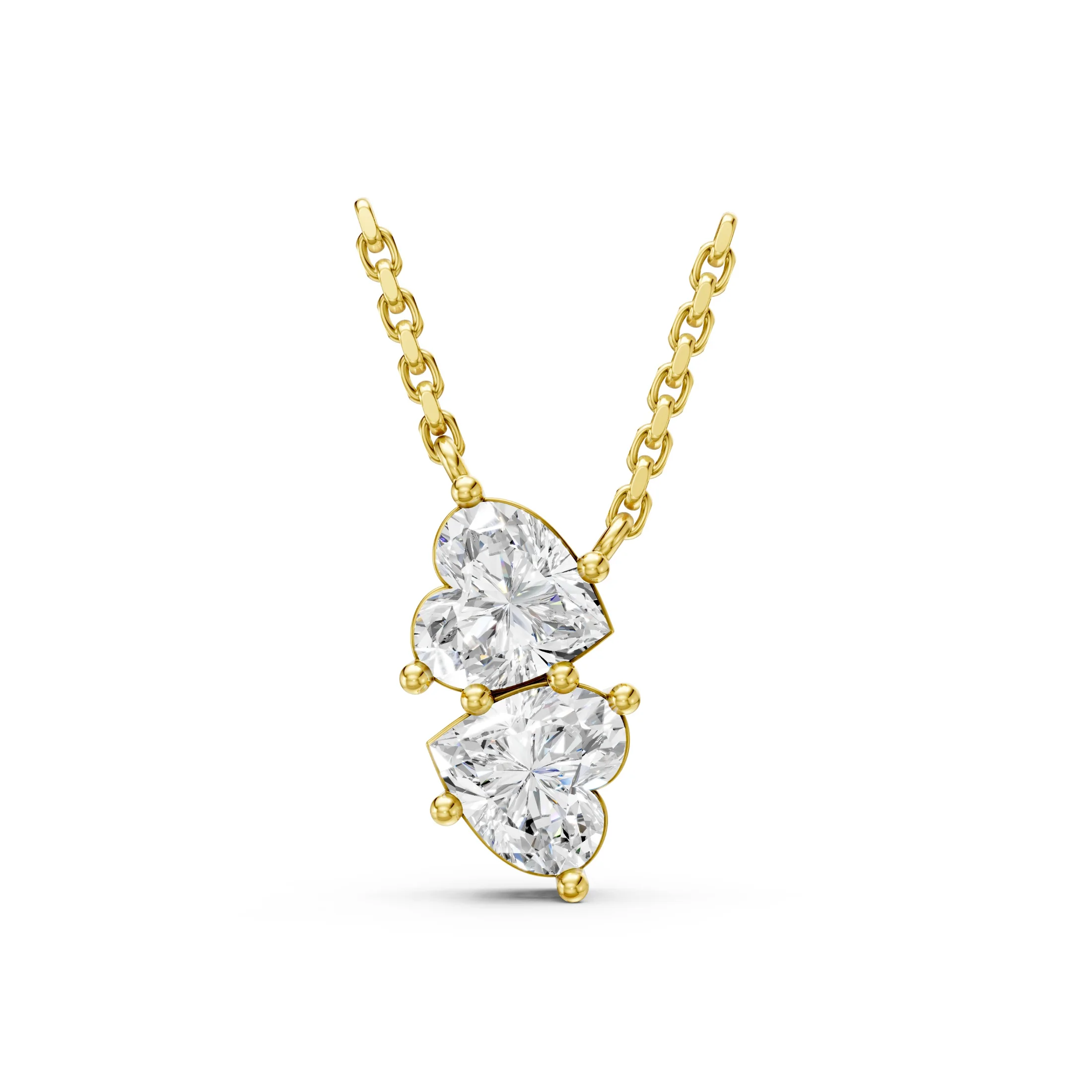 Two heart-cut diamond drop necklace with vertically arranged three-prong settings.