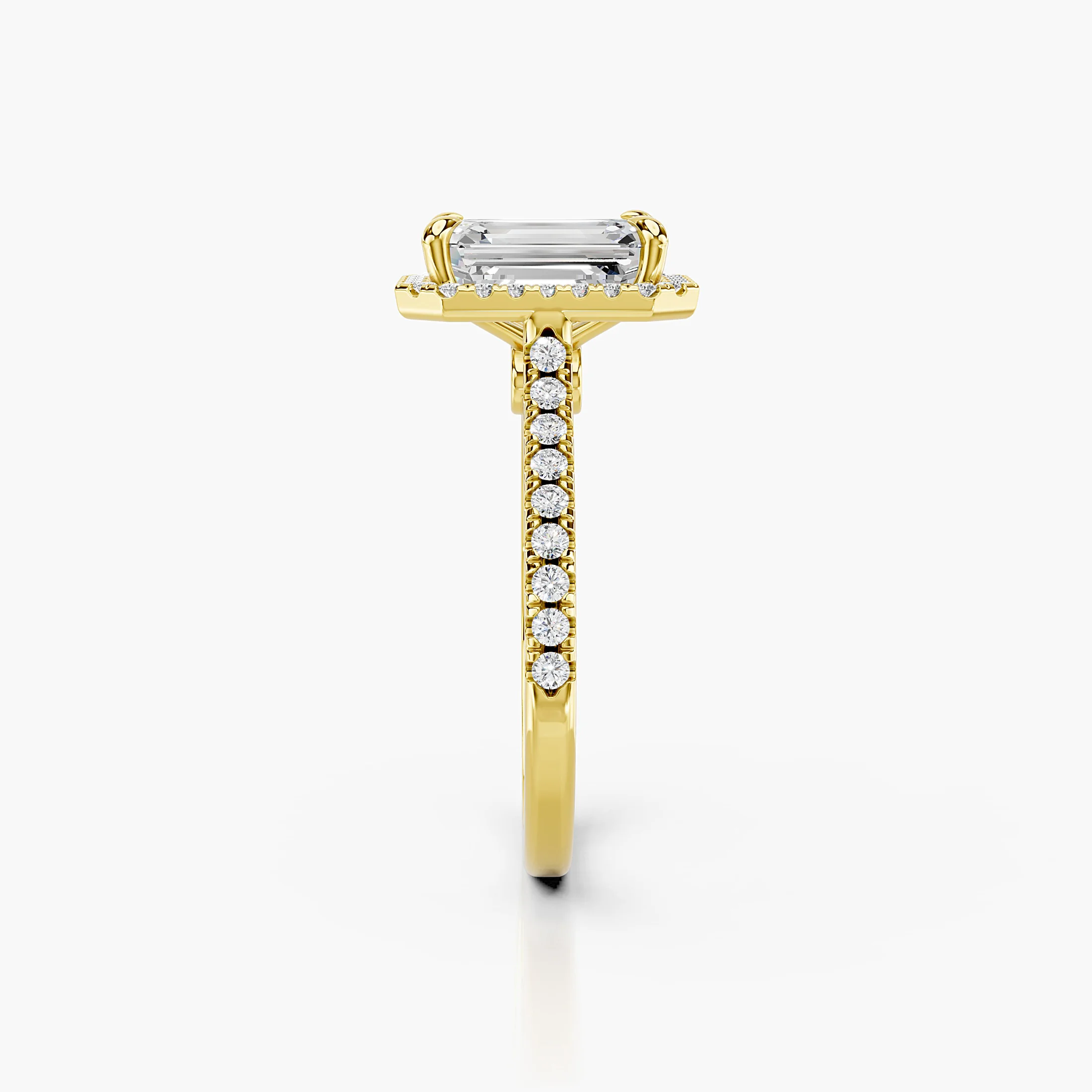 Emerald-cut lab-grown diamond engagement ring with a rectangular halo and diamond-set band.