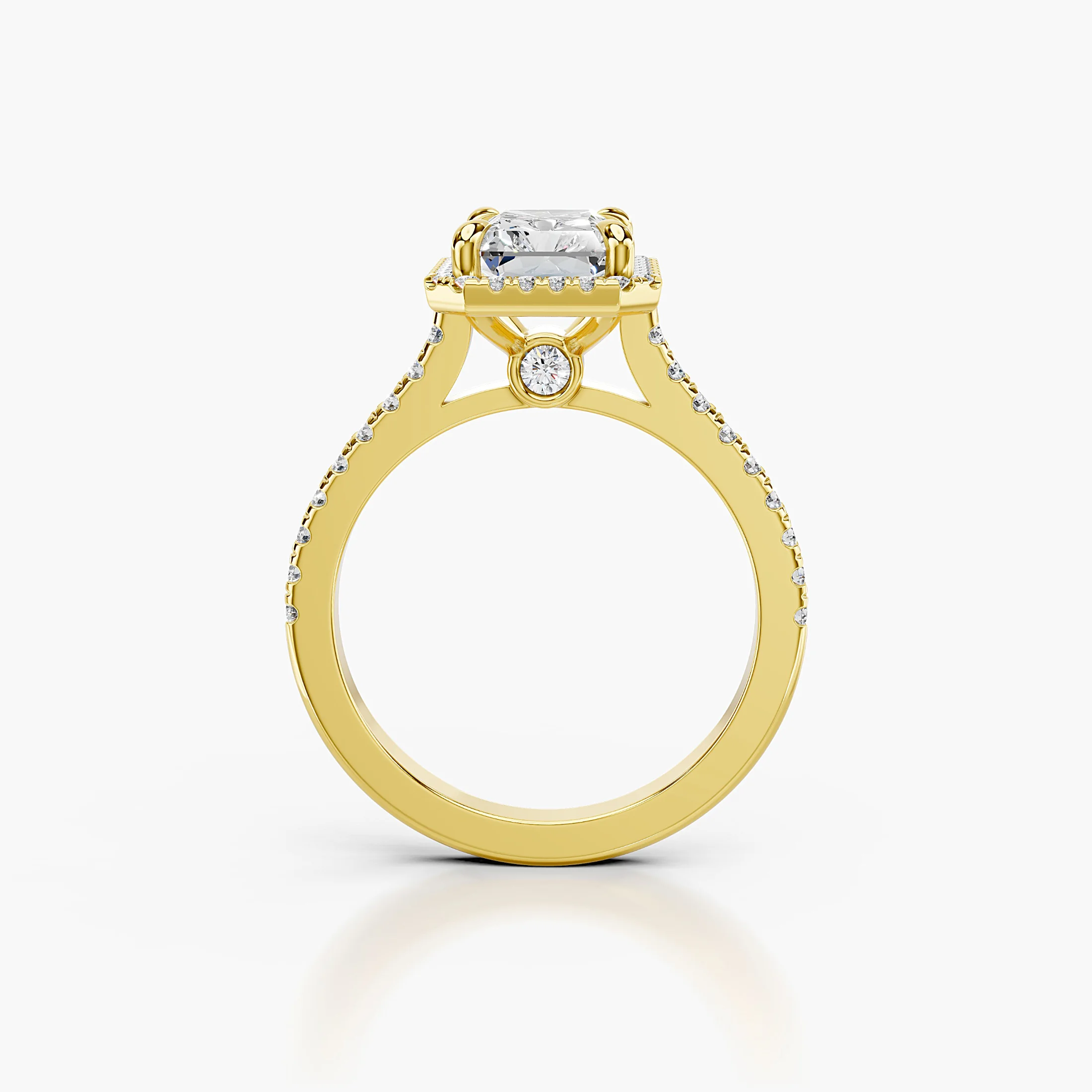 Radiant-cut lab-grown diamond engagement ring with a geometric halo and diamond-set band.