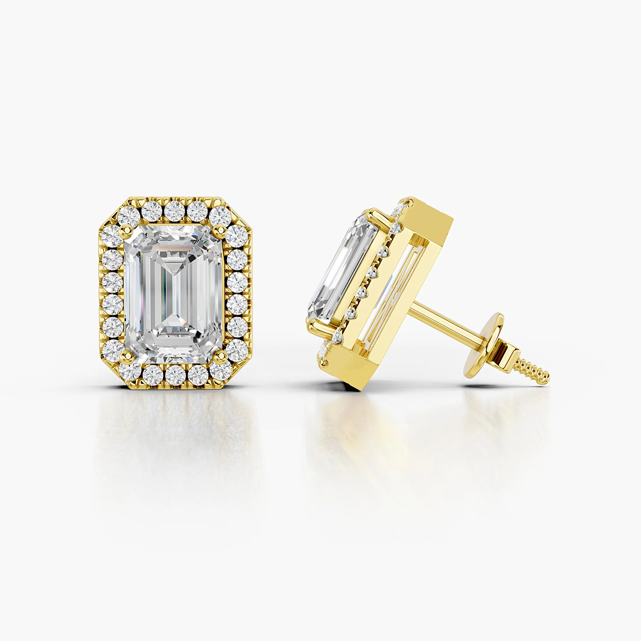 Emerald-cut diamond stud earrings with clipped-corner round diamond halos.