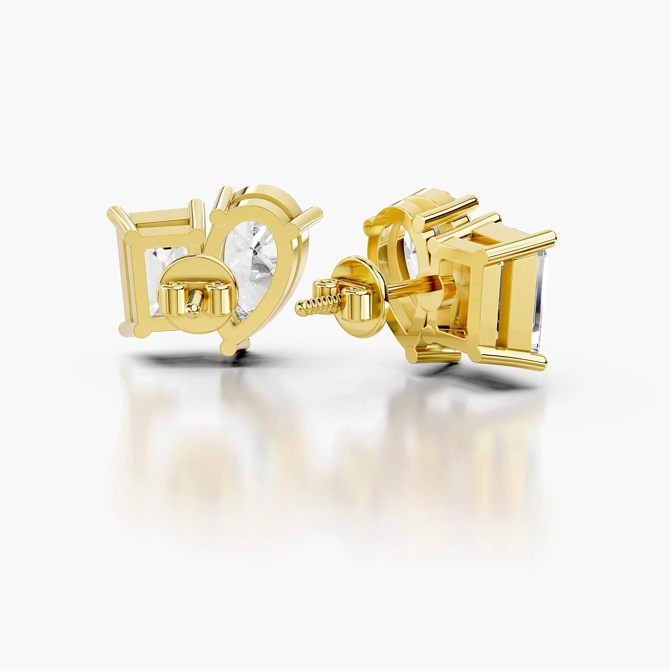 Pear-cut and emerald-cut diamond duo stud earrings in a mirrored design.