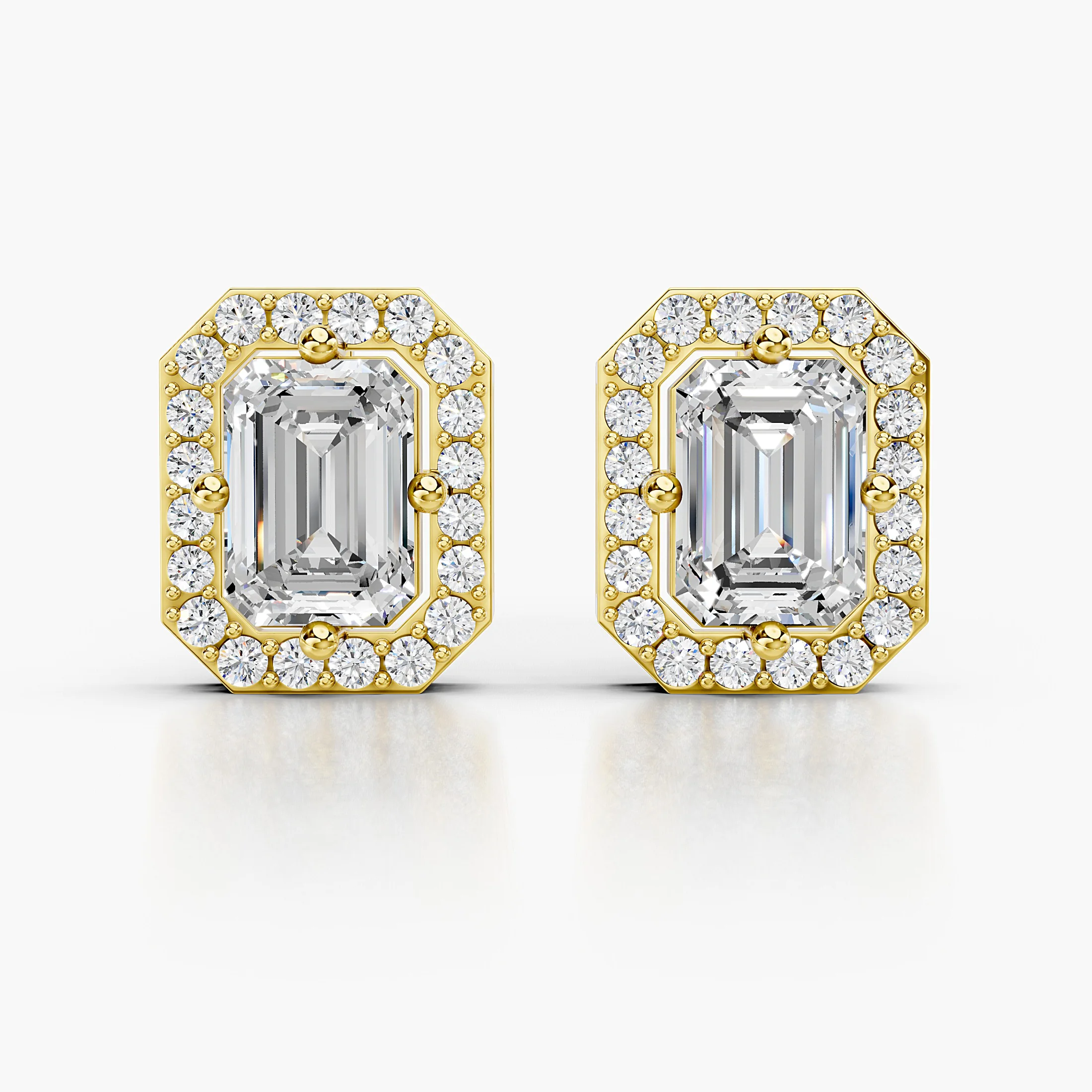 Emerald diamond stud earrings with geometric round diamond halos and screw-back closures