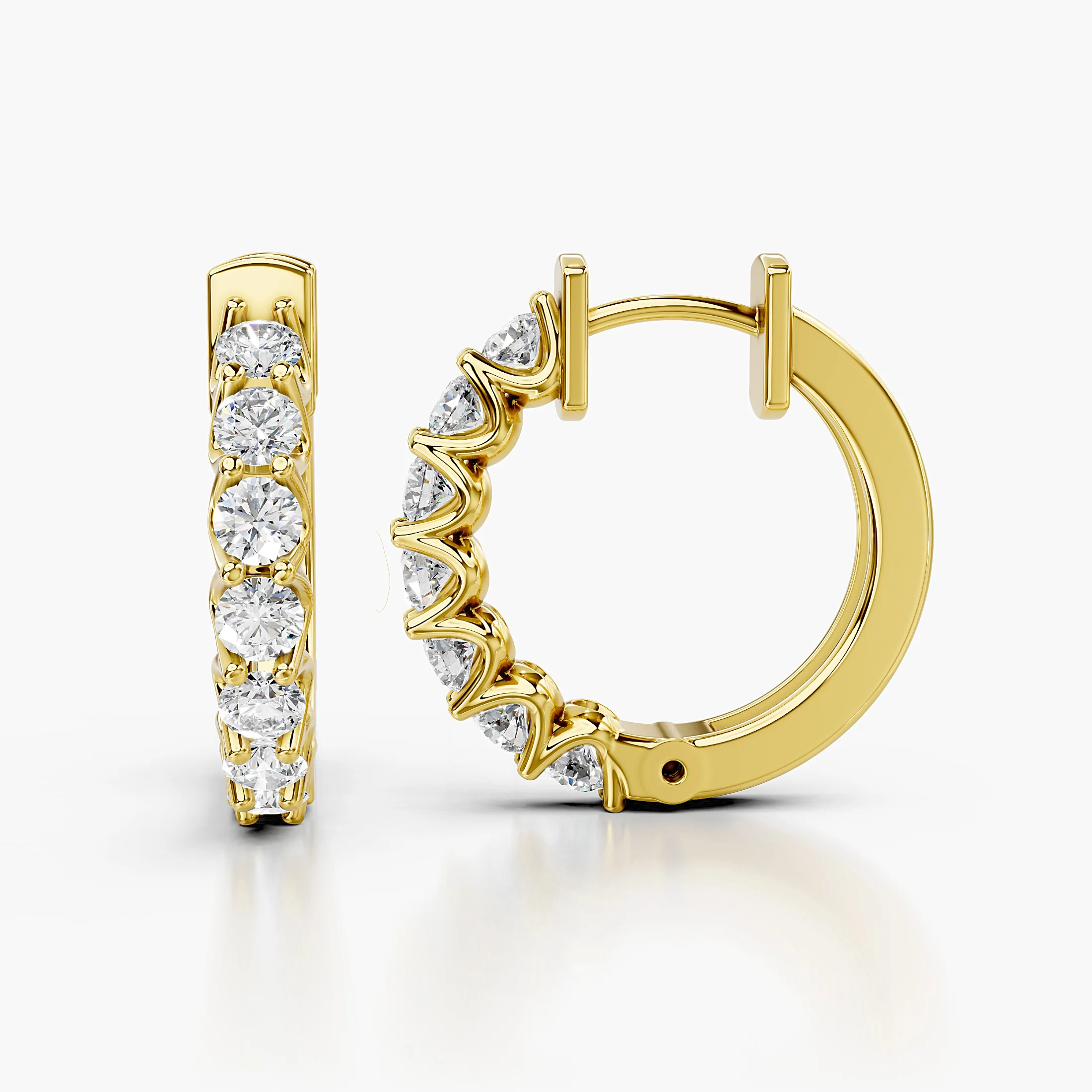 Round diamond seven-stone hoop earrings with shared-prong settings.