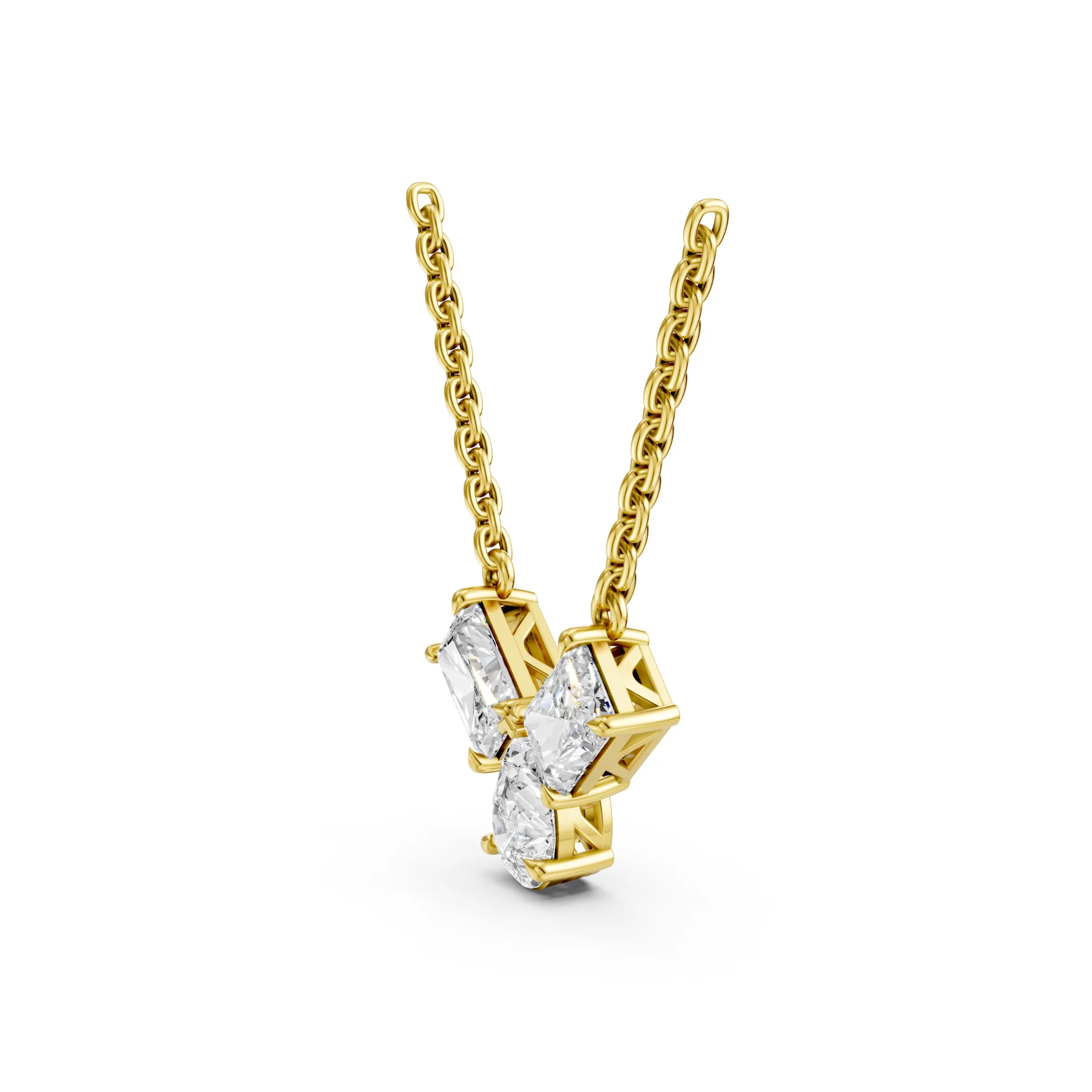 Radiant and pear-cut diamond multi-stone necklace with three diamonds arranged in a V-shaped vertical drop.