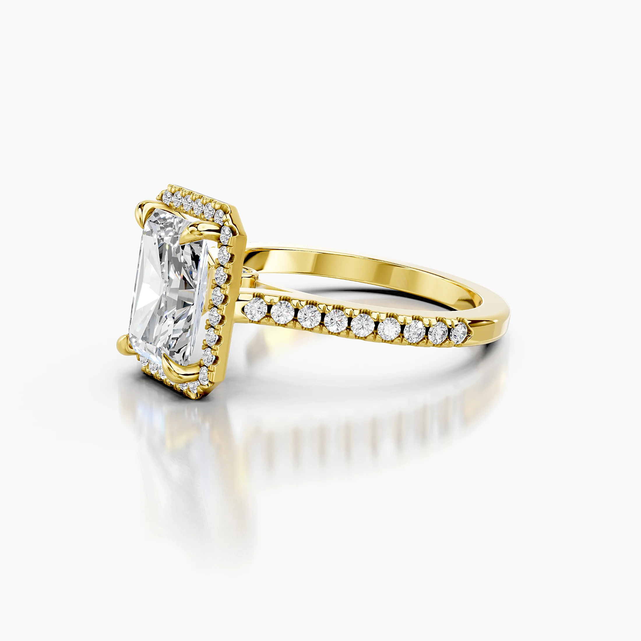 Radiant-cut lab-grown diamond engagement ring with a geometric halo and diamond-set band.