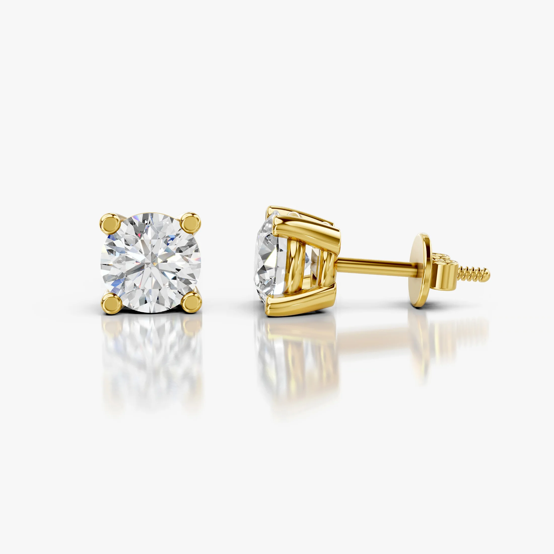 Round diamond solitaire stud earrings with four-prong basket settings and screw-back closures
