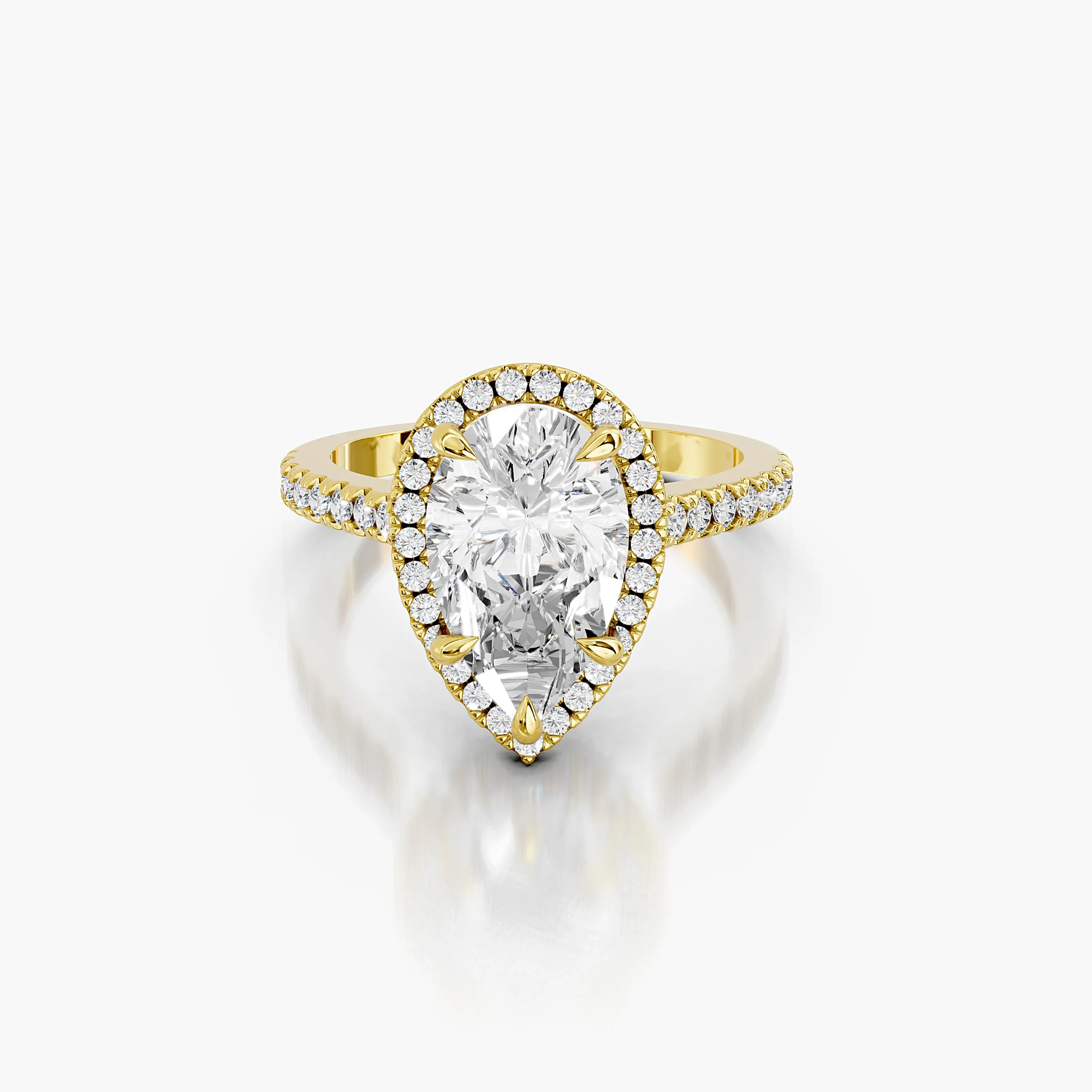 Pear-cut lab-grown diamond engagement ring with a matching halo and diamond-set band.