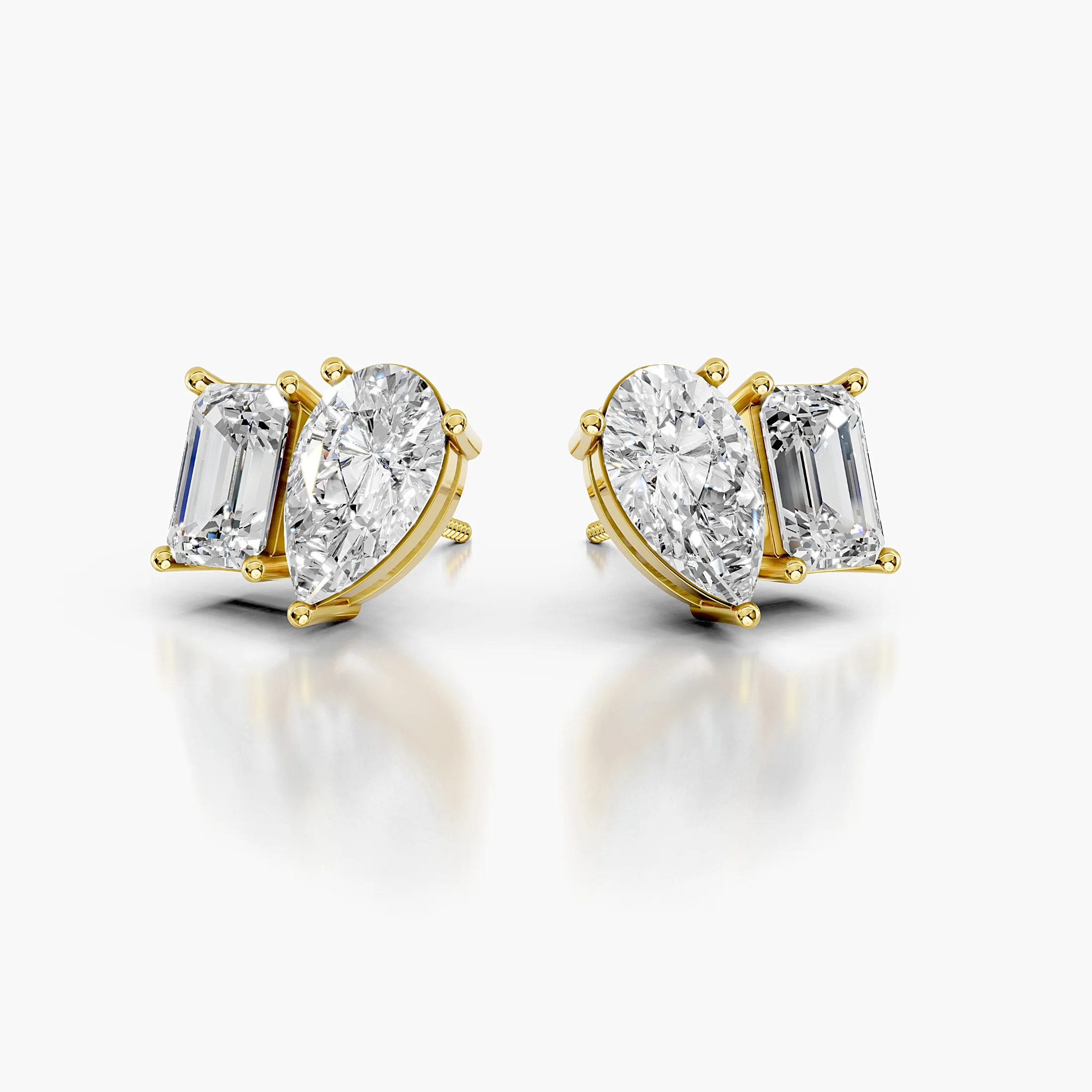 Pear-cut and emerald-cut diamond duo stud earrings in a mirrored design.