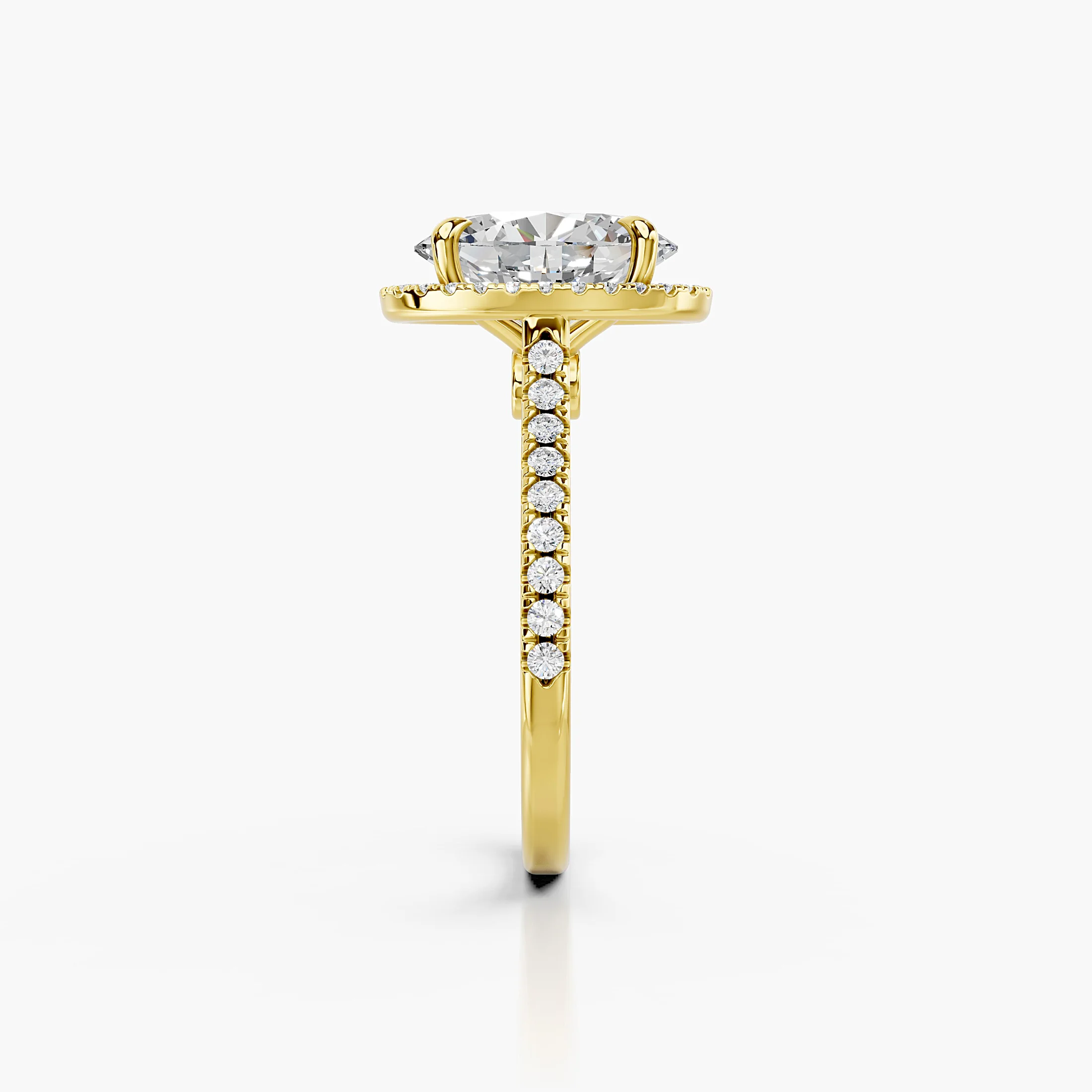 Oval-cut lab-grown diamond engagement ring with a matching halo and diamond-set band.