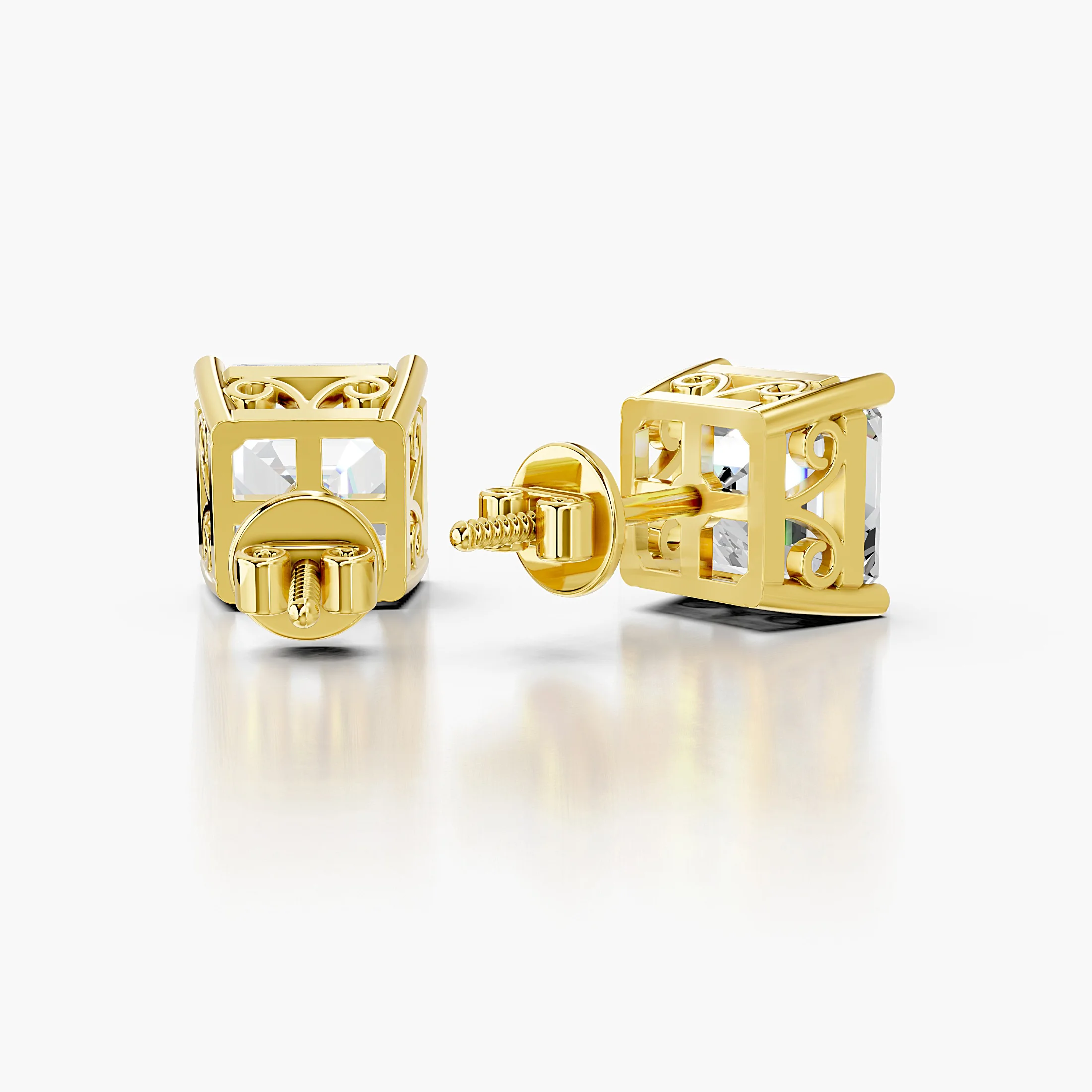 Pair of emerald-cut lab-grown diamond solitaire stud earrings in four-prong settings.
