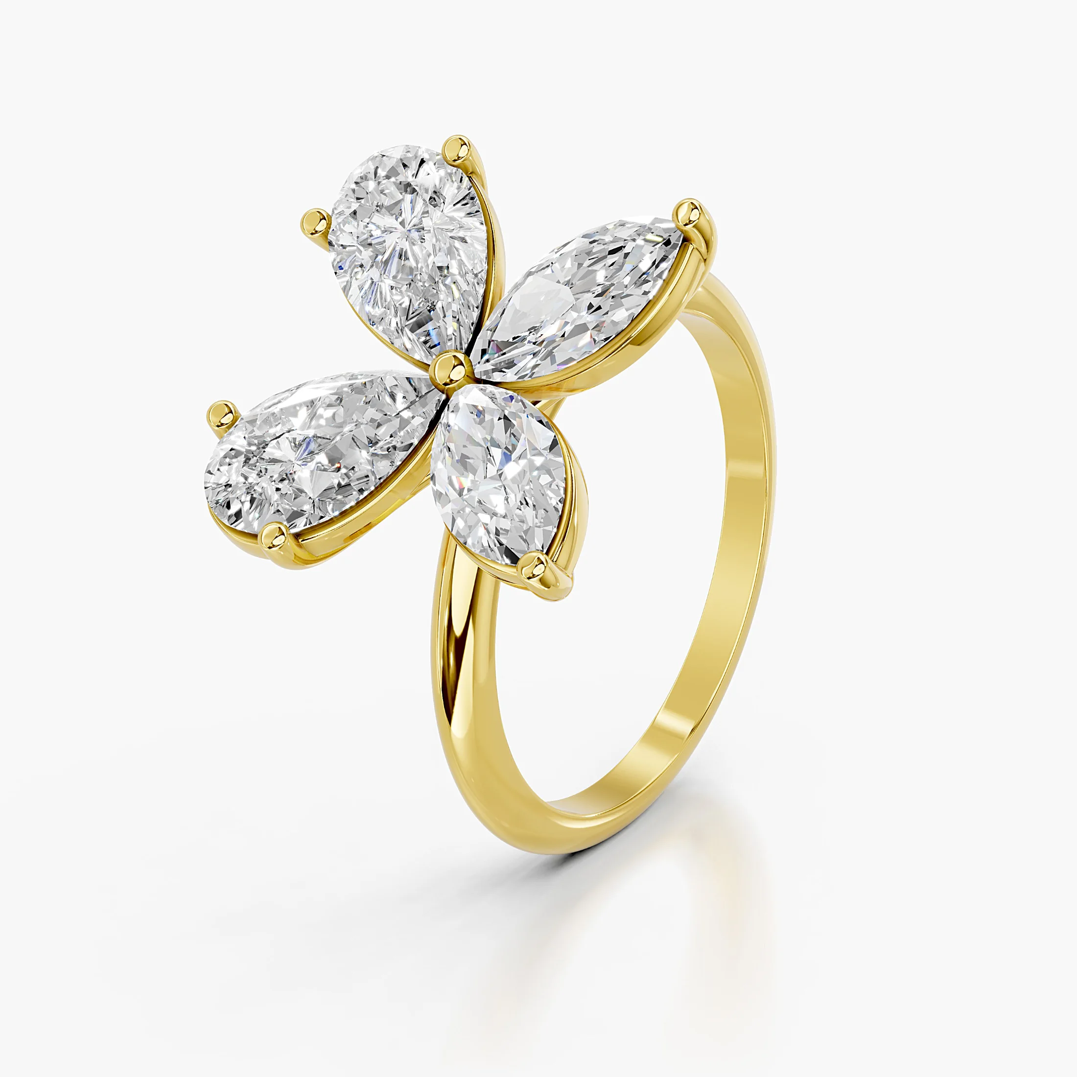 Four-petal diamond ring formed by two pear-cut and two marquise-cut stones on a polished band.