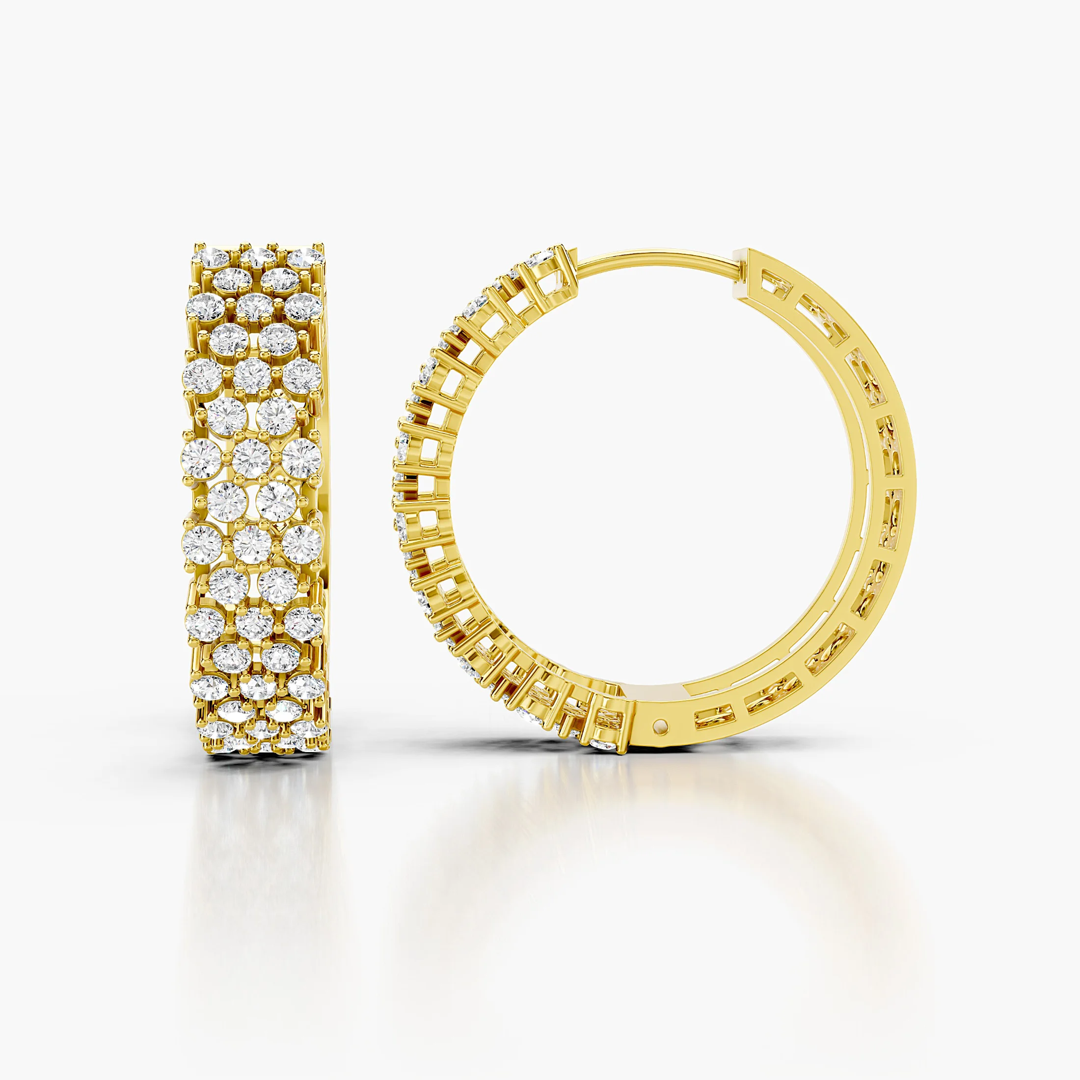 Pair of broad diamond hoop earrings featuring three continuous rows of round stones.