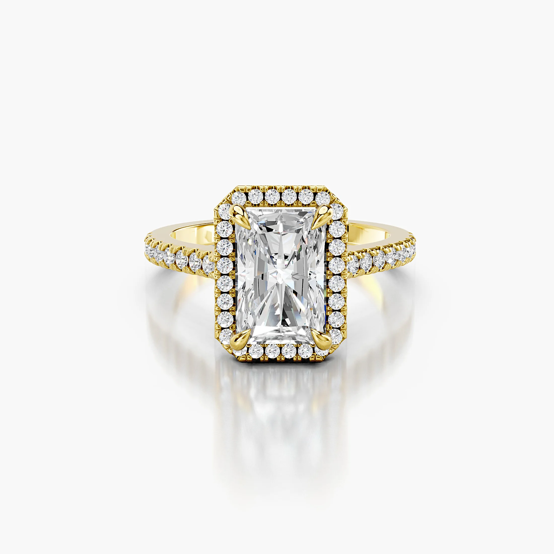 Radiant-cut lab-grown diamond engagement ring with a geometric halo and diamond-set band.