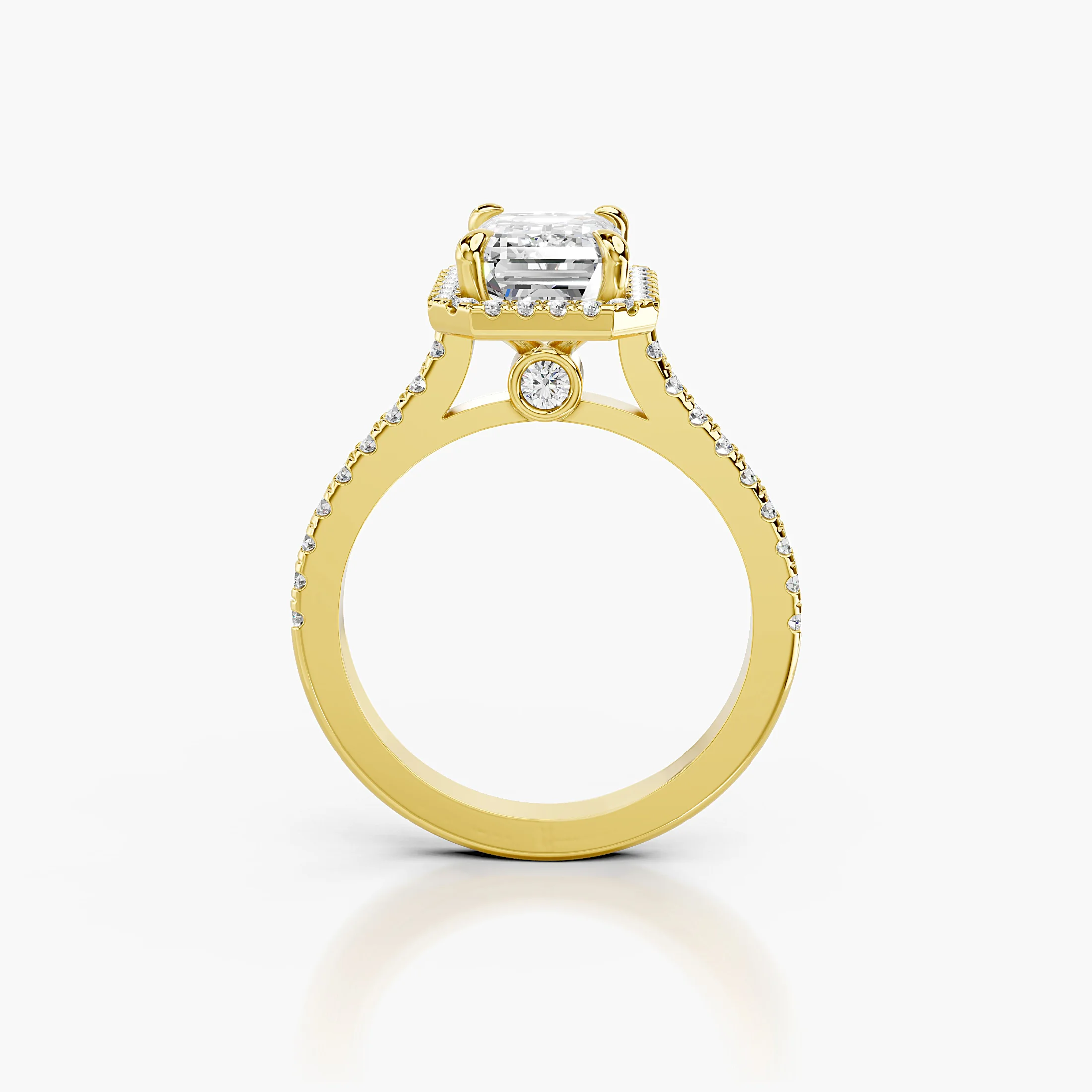 Emerald-cut lab-grown diamond engagement ring with a rectangular halo and diamond-set band.