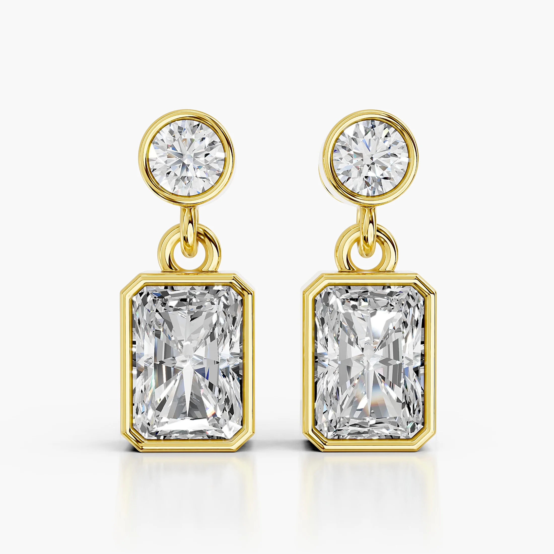 Radiant-cut and round diamond bezel drop earrings with articulated connectors.