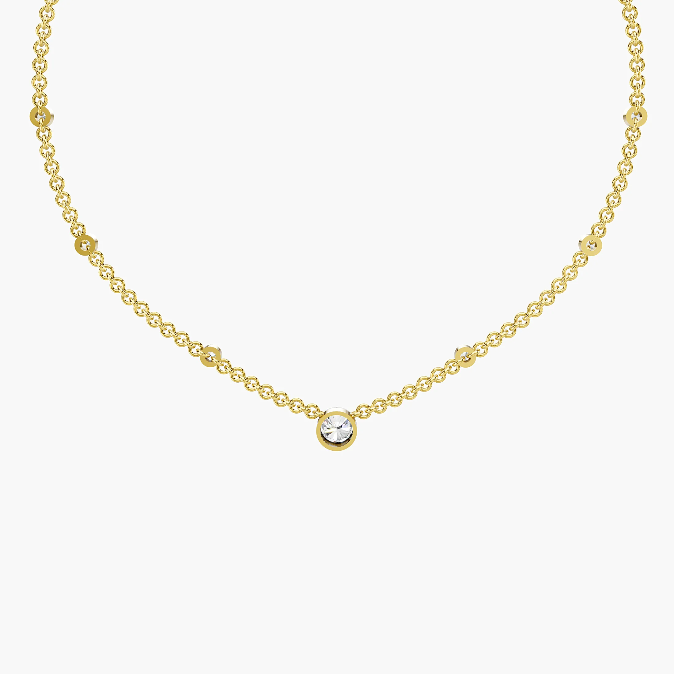 Seven-stone necklace with a larger round center diamond and six smaller round diamonds spaced along the chain