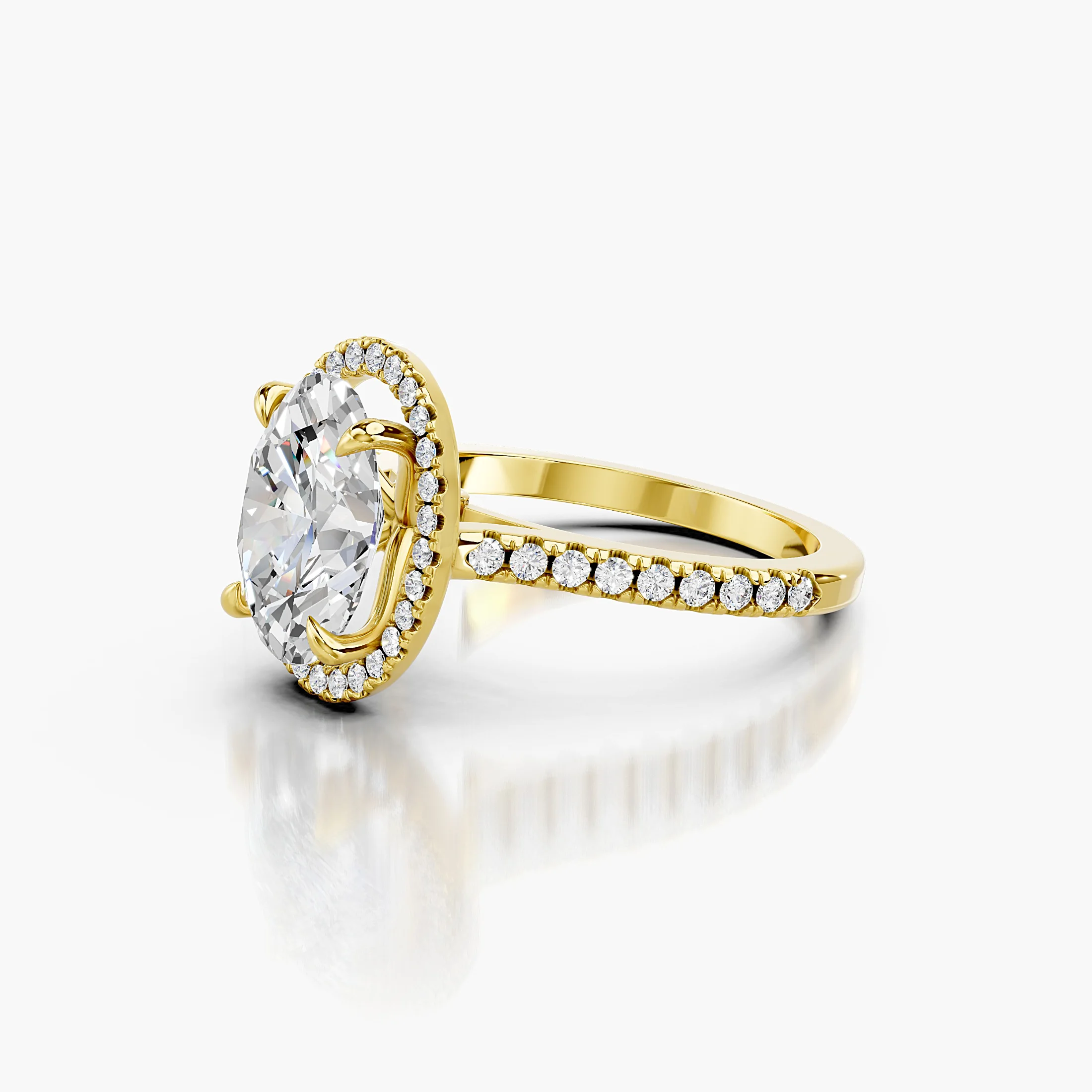 Oval-cut lab-grown diamond engagement ring with a matching halo and diamond-set band.