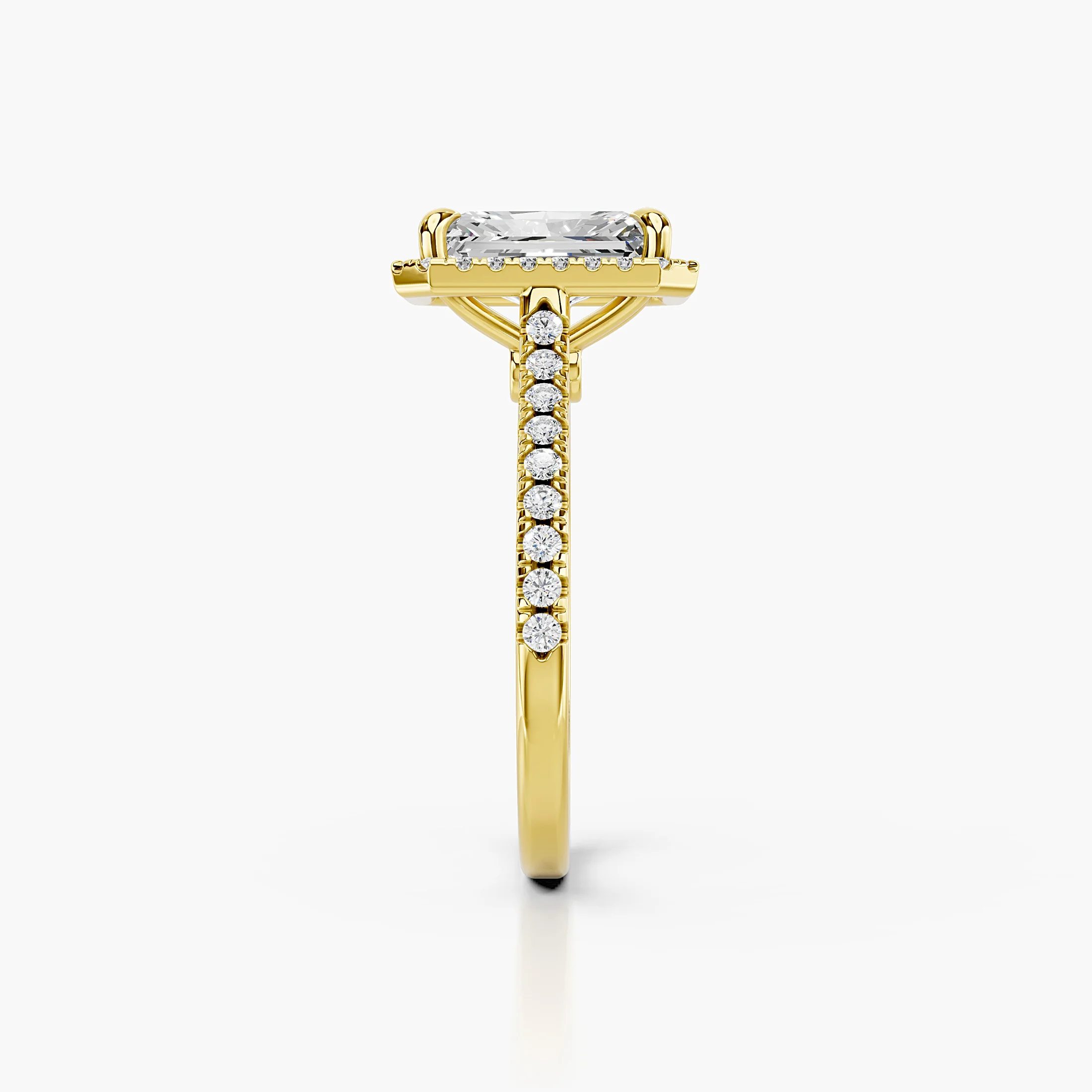 Radiant-cut lab-grown diamond engagement ring with a geometric halo and diamond-set band.