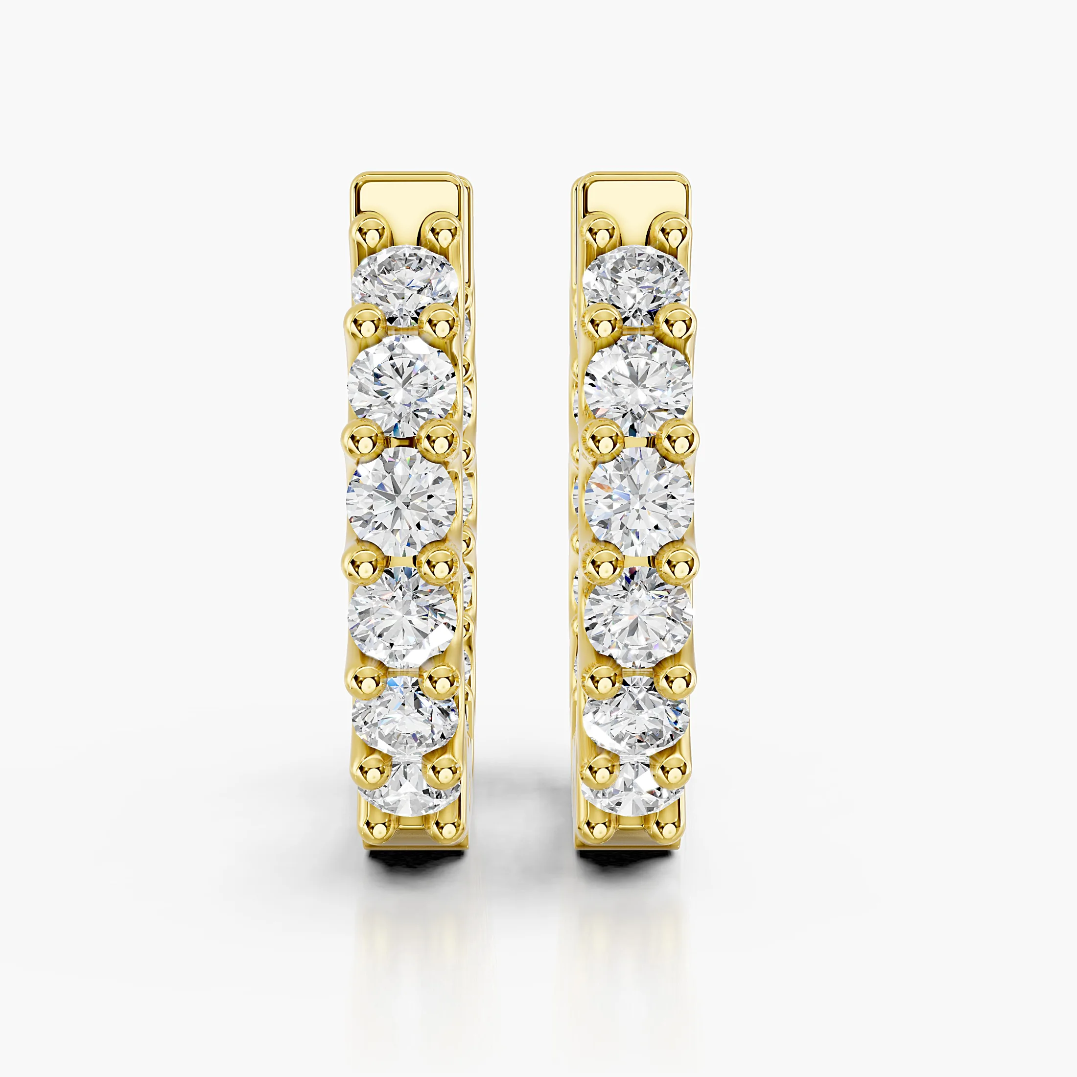 Round diamond classic hoop earrings with shared-prong settings.