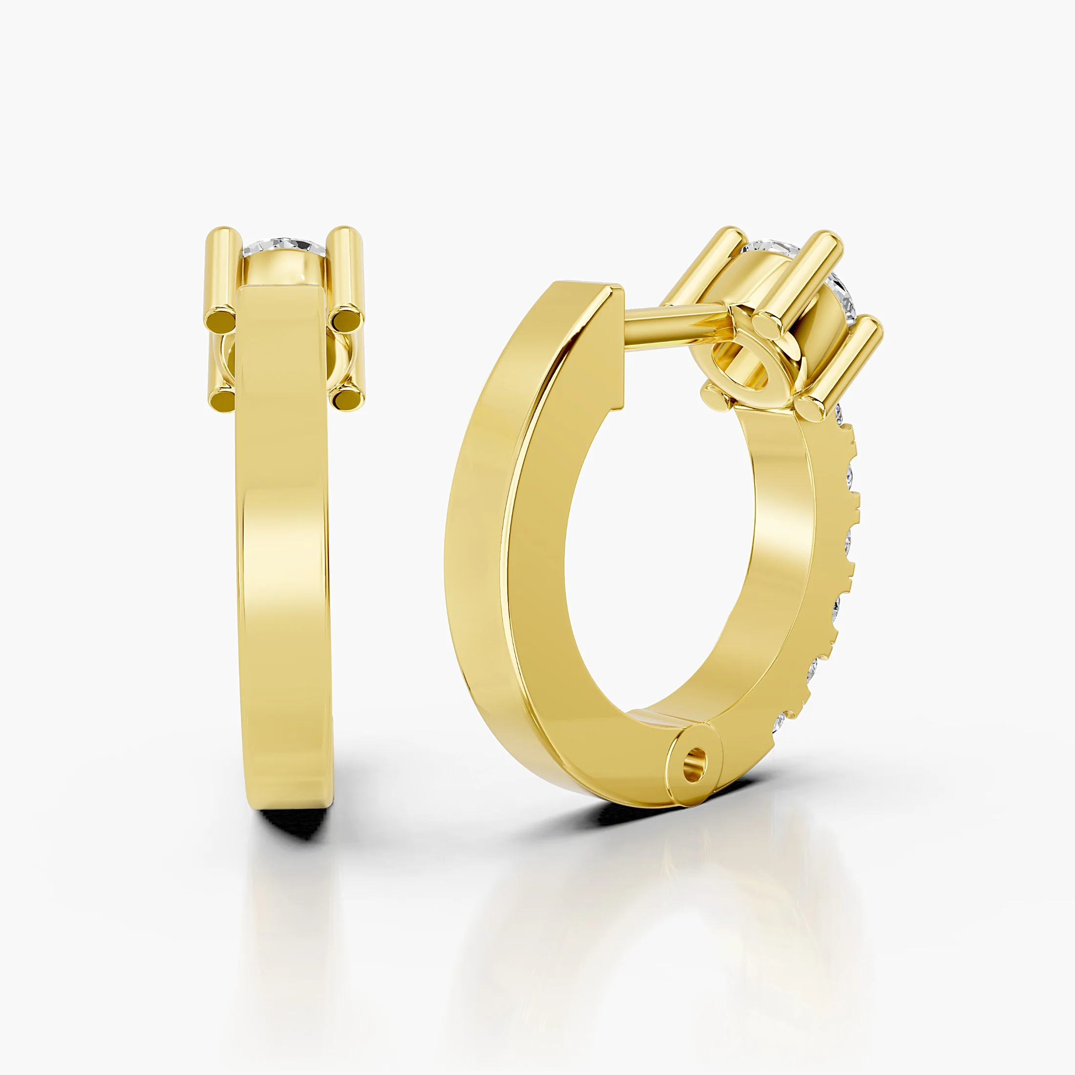 Pair of graduated round diamond hoop earrings with raised crown-set feature stones.