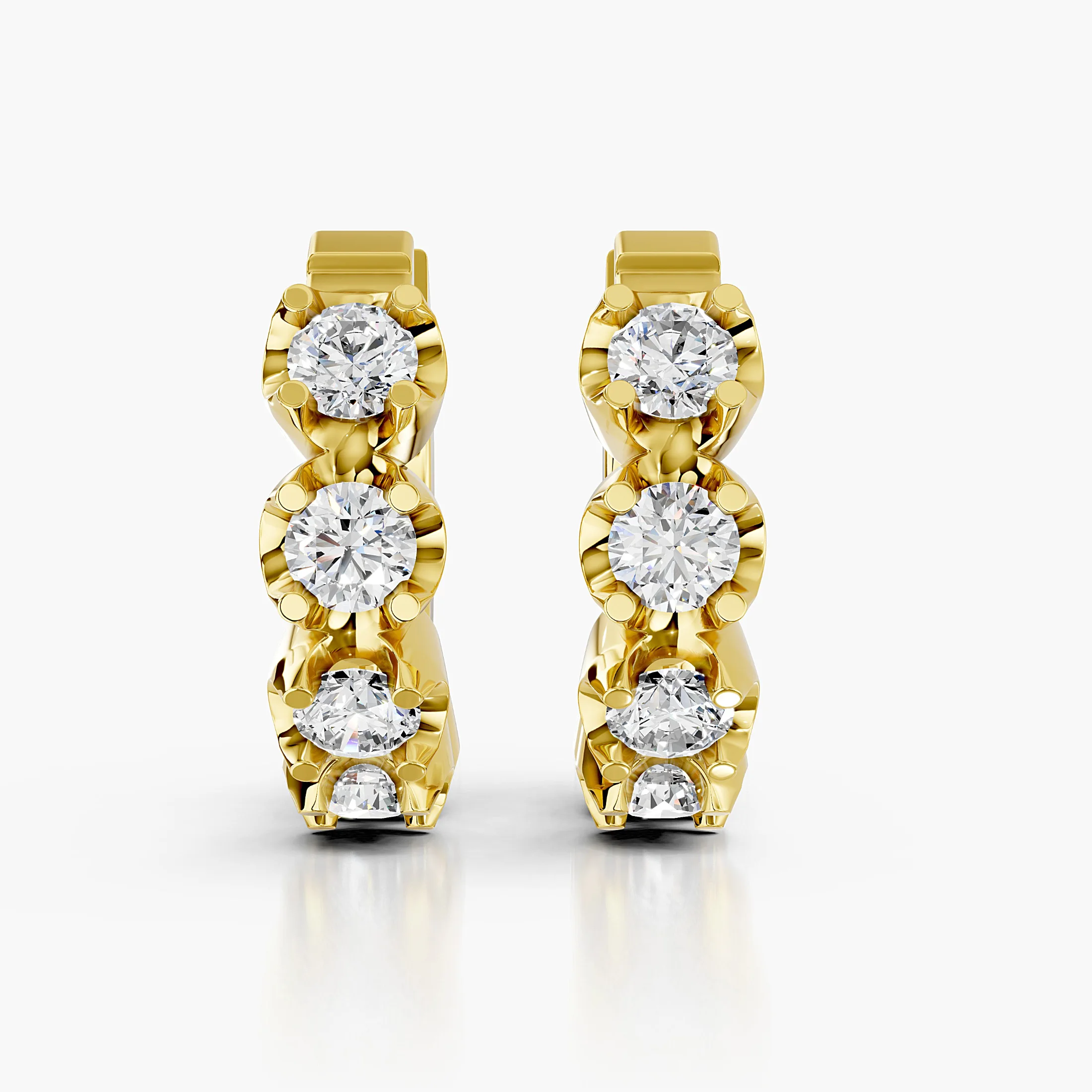 Round diamond five-stone huggie earrings with four-prong settings.